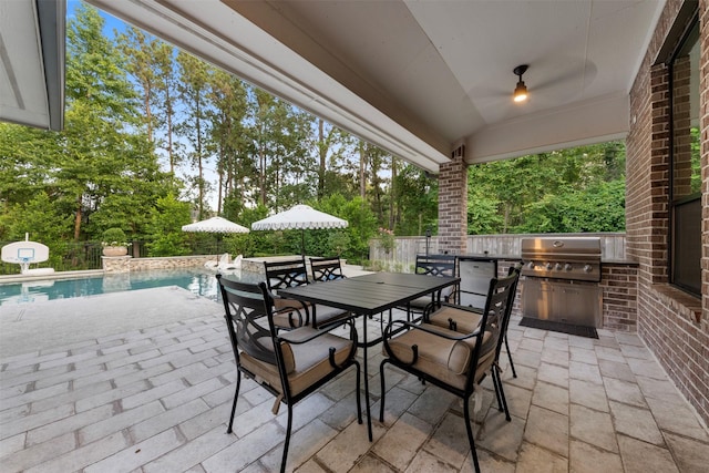 308 Lane Landing Pl, Montgomery, TX 77316 - fenced backyard with a patio area, outdoor dining area, and view of scattered trees
