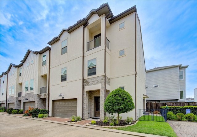 10918 Brookeshire Chase Ln, Houston, TX 77043 - view of building exterior featuring a garage, a residential view, and driveway