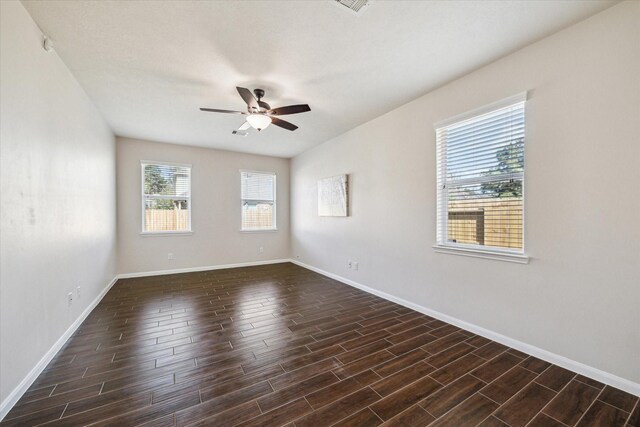 13303 Bomoseen Lake Rd, Houston, TX 77044 - empty room with ceiling fan, dark wood finished floors, and baseboards