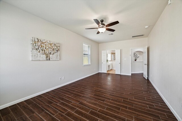 13303 Bomoseen Lake Rd, Houston, TX 77044 - spare room featuring ceiling fan, wood finished floors, baseboards, and a smoke detector