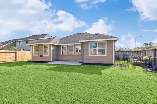13303 Bomoseen Lake Rd, Houston, TX 77044 - back of property featuring a patio and a shingled roof
