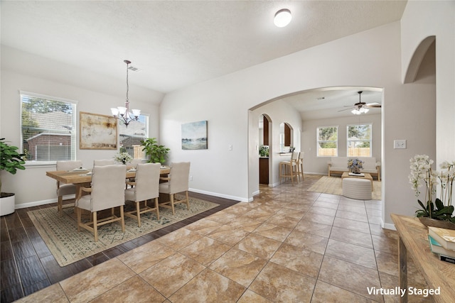 13303 Bomoseen Lake Rd, Houston, TX 77044 - dining space featuring arched walkways, baseboards, a chandelier, and a ceiling fan