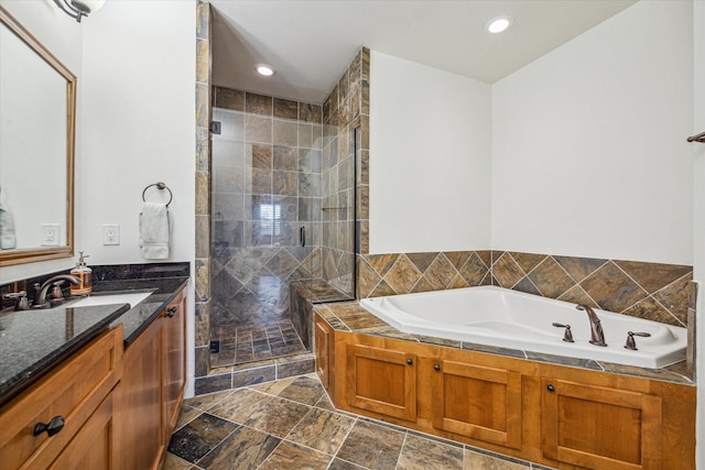 6110 Clyde St, Houston, TX 77007 - full bathroom with vanity, a shower stall, a garden tub, and recessed lighting