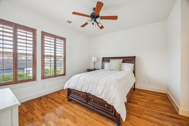 6110 Clyde St, Houston, TX 77007 - bedroom featuring baseboards, light wood finished floors, and a ceiling fan