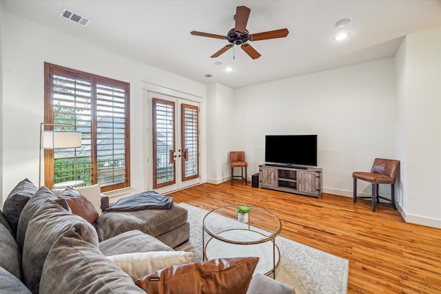 6110 Clyde St, Houston, TX 77007 - living area with french doors, light wood finished floors, baseboards, ceiling fan, and recessed lighting