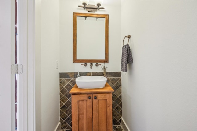 6110 Clyde St, Houston, TX 77007 - bathroom featuring vanity, tile walls, and a wainscoted wall