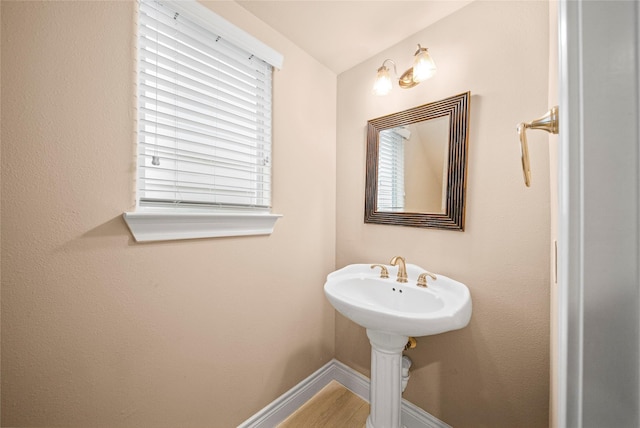 2804 Sherwin St, Houston, TX 77007 - bathroom featuring baseboards and wood finished floors
