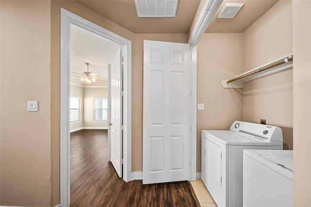 2804 Sherwin St, Houston, TX 77007 - washroom with washing machine and clothes dryer, baseboards, light wood-style flooring, and crown molding