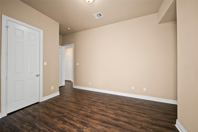 2804 Sherwin St, Houston, TX 77007 - unfurnished bedroom featuring dark wood-style flooring and baseboards