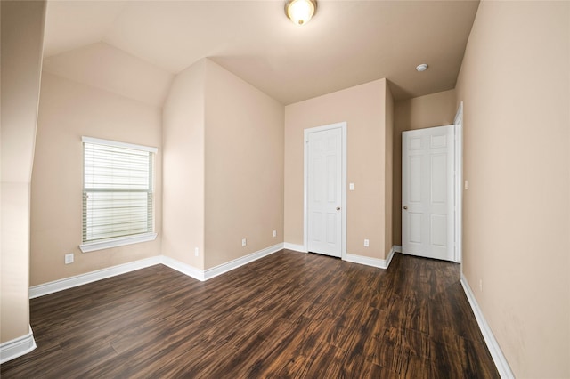 2804 Sherwin St, Houston, TX 77007 - unfurnished bedroom featuring dark wood finished floors, baseboards, and lofted ceiling