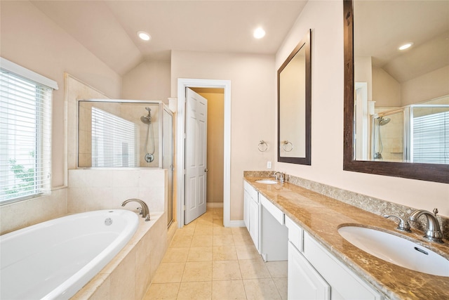 2804 Sherwin St, Houston, TX 77007 - bathroom with a stall shower, vaulted ceiling, a bath, double vanity, and recessed lighting