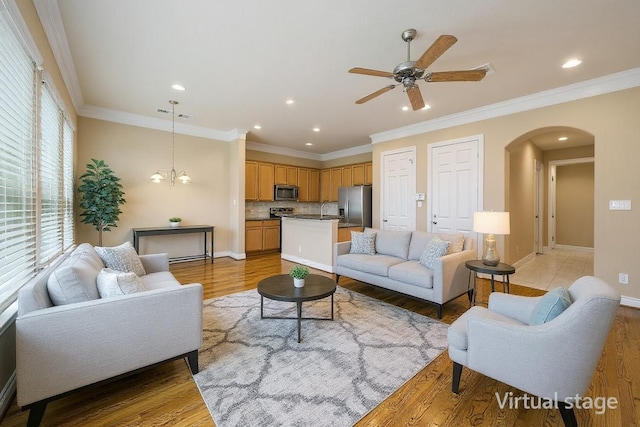2804 Sherwin St, Houston, TX 77007 - living area featuring arched walkways, ceiling fan, light wood-style floors, recessed lighting, and ornamental molding
