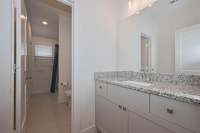 21307 Metallic Blue Dr, Cypress, TX 77433 - bathroom with toilet, vanity, tile patterned flooring, baseboards, and curtained shower