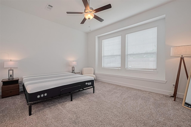 21307 Metallic Blue Dr, Cypress, TX 77433 - carpeted bedroom with baseboards and ceiling fan