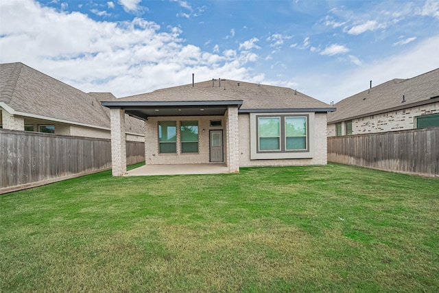 21307 Metallic Blue Dr, Cypress, TX 77433 - back of property with a patio area, roof with shingles, and brick siding