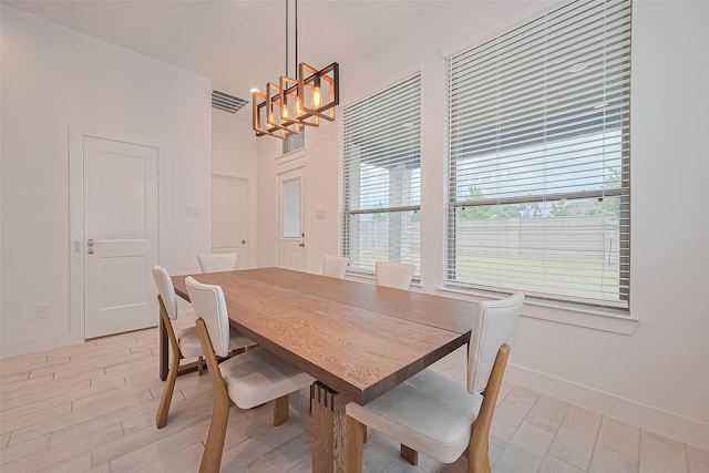 21307 Metallic Blue Dr, Cypress, TX 77433 - dining space featuring a chandelier and baseboards
