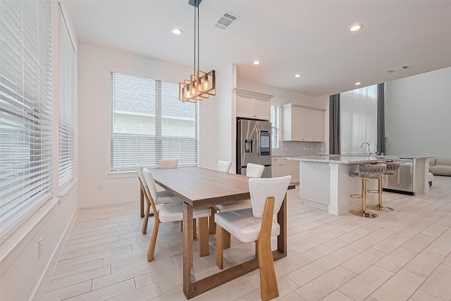 21307 Metallic Blue Dr, Cypress, TX 77433 - dining room featuring recessed lighting, a chandelier, and baseboards
