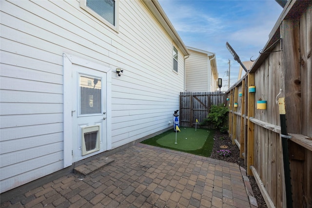 1405 Saulnier St, Houston, TX 77019 - fenced backyard with a patio area and an area to practice putting