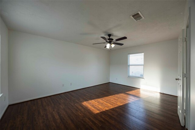 1405 Saulnier St, Houston, TX 77019 - spare room featuring dark wood-style floors and a ceiling fan