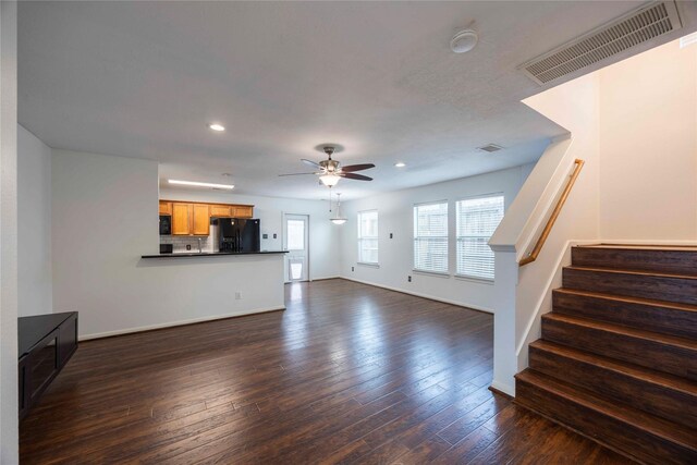 1405 Saulnier St, Houston, TX 77019 - unfurnished living room featuring a ceiling fan, recessed lighting, stairs, and dark wood finished floors