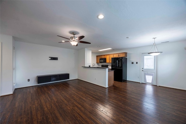 1405 Saulnier St, Houston, TX 77019 - unfurnished living room with dark wood-style floors, ceiling fan, and recessed lighting