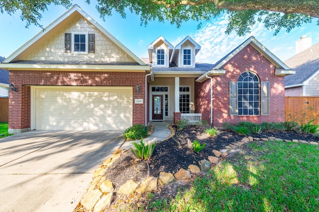 5226 Englewood Point Ct, Katy, TX 77494 - traditional home featuring a porch, brick siding, and driveway