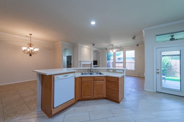 5226 Englewood Point Ct, Katy, TX 77494 - kitchen featuring dishwasher, a sink, arched walkways, open floor plan, and light countertops