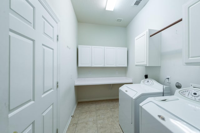 5226 Englewood Point Ct, Katy, TX 77494 - laundry area with cabinet space, washer and clothes dryer, and baseboards