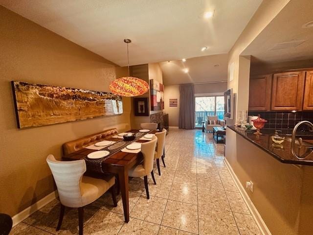 12660 Hillcrest Rd Unit 2203, Dallas, TX 75230 - dining room featuring baseboards and light tile patterned flooring