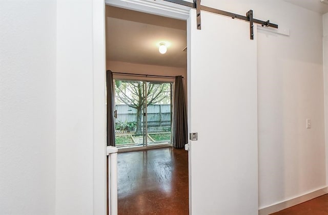 6935 Yellowstone Way Dr, Houston, TX 77054 - corridor with a barn door and concrete floors