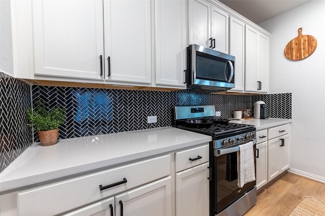 16935 Lagos Ln, Crosby, TX 77532 - kitchen featuring stainless steel appliances, light wood-type flooring, decorative backsplash, and light countertops