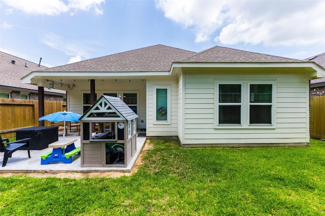 16935 Lagos Ln, Crosby, TX 77532 - rear view of property featuring a patio, a fire pit, and roof with shingles