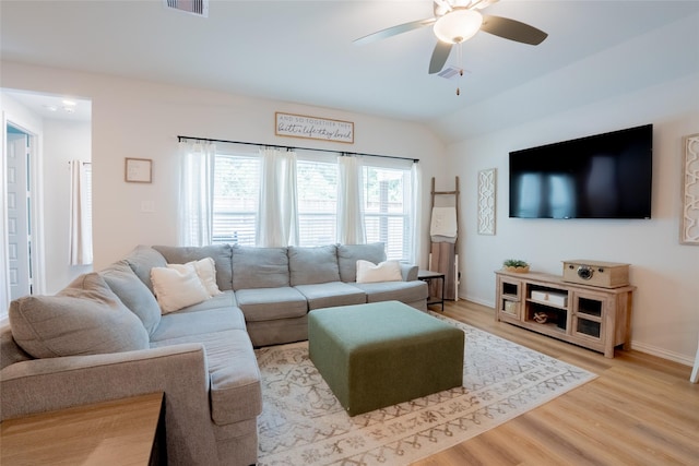16935 Lagos Ln, Crosby, TX 77532 - living area with ceiling fan, light wood-style flooring, baseboards, and vaulted ceiling