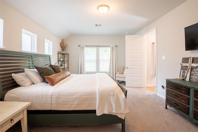 16935 Lagos Ln, Crosby, TX 77532 - bedroom with light carpet, baseboards, and vaulted ceiling