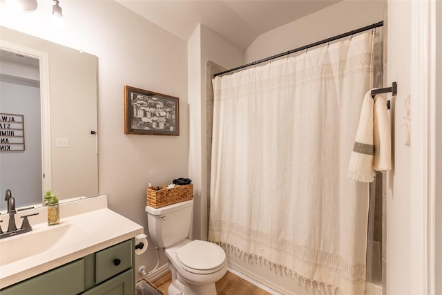 16935 Lagos Ln, Crosby, TX 77532 - full bathroom with vanity, toilet, wood finished floors, and shower / bath combo