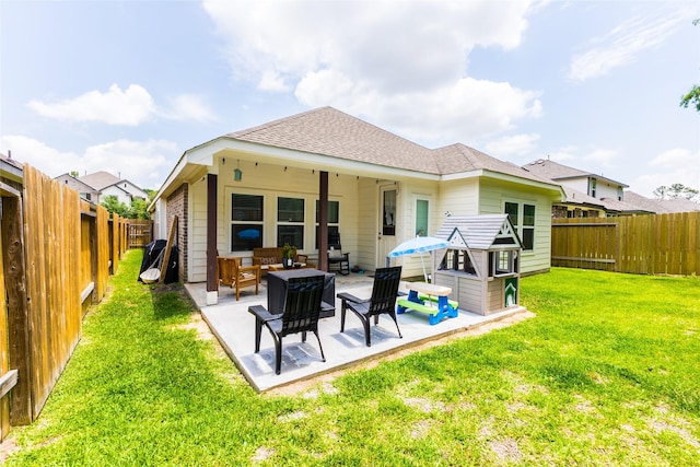 16935 Lagos Ln, Crosby, TX 77532 - rear view of house with outdoor lounge area, a patio, and roof with shingles