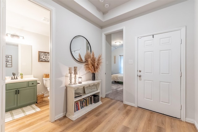 16935 Lagos Ln, Crosby, TX 77532 - entrance foyer with light wood-style flooring and baseboards