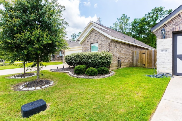 16935 Lagos Ln, Crosby, TX 77532 - view of side of property featuring brick siding and an attached garage