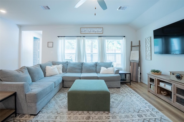 16935 Lagos Ln, Crosby, TX 77532 - living room featuring a ceiling fan, light wood finished floors, and lofted ceiling