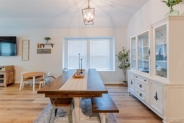 16935 Lagos Ln, Crosby, TX 77532 - dining room with a chandelier, light wood finished floors, and baseboards