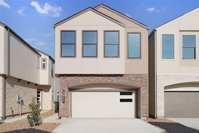 2931 El Fenice Ln, Houston, TX 77057 - view of front facade featuring stone siding, stucco siding, and driveway