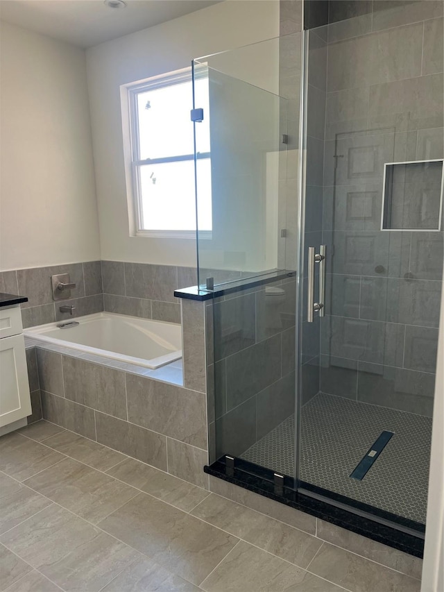 2931 El Fenice Ln, Houston, TX 77057 - full bath with a garden tub, tile patterned flooring, and a stall shower