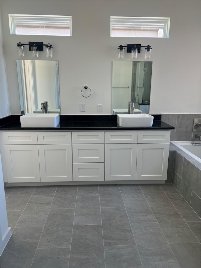 2931 El Fenice Ln, Houston, TX 77057 - full bathroom featuring double vanity and tiled bath