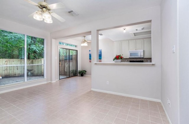 134 Willowwood Cir, The Woodlands, TX 77381 - unfurnished living room with ceiling fan and baseboards