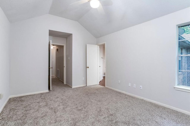 134 Willowwood Cir, The Woodlands, TX 77381 - unfurnished bedroom with carpet floors, vaulted ceiling, a ceiling fan, and baseboards