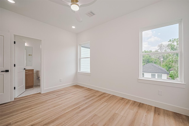 6023 Maybell, Houston, TX 77091 - unfurnished bedroom with light wood finished floors, baseboards, ensuite bath, recessed lighting, and ceiling fan
