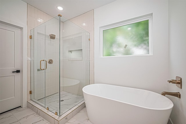 6023 Maybell, Houston, TX 77091 - full bath with a freestanding tub, marble look tile flooring, a shower stall, and recessed lighting