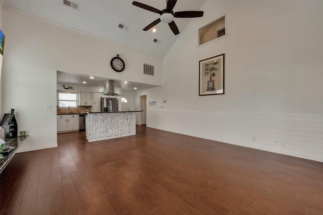 1302 Tiki Dr, Tiki Island, TX 77554 - unfurnished living room with ceiling fan, high vaulted ceiling, dark wood finished floors, and a sink