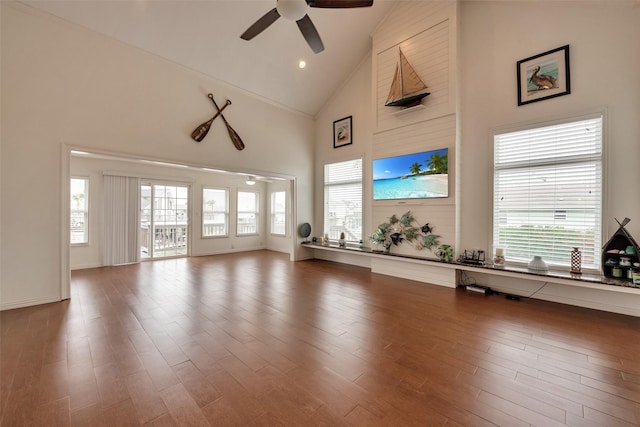 1302 Tiki Dr, Tiki Island, TX 77554 - living room with a ceiling fan, high vaulted ceiling, and wood finished floors