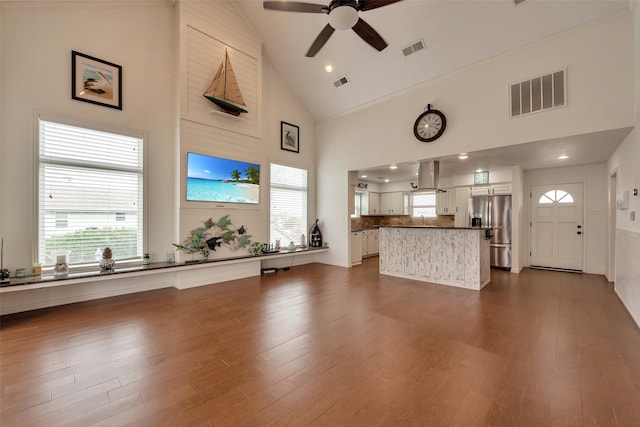 1302 Tiki Dr, Tiki Island, TX 77554 - living area with ceiling fan, high vaulted ceiling, and dark wood-style floors